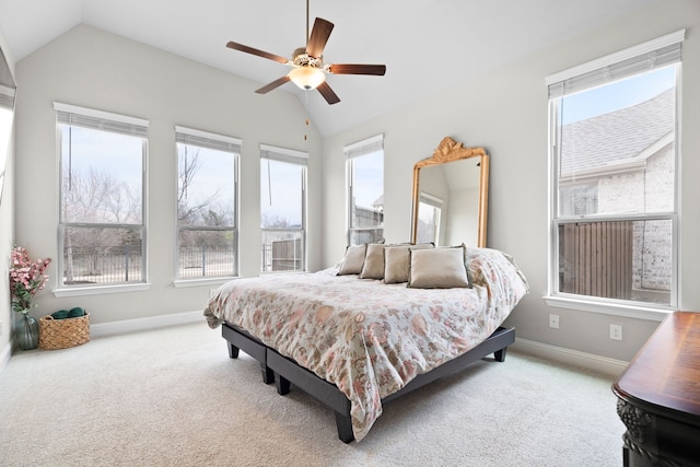 720 Waterbrook Pkwy, Argyle, TX 76226 - carpeted bedroom with vaulted ceiling, multiple windows, baseboards, and a ceiling fan