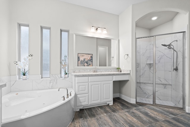 720 Waterbrook Pkwy, Argyle, TX 76226 - full bathroom with a marble finish shower, a jetted tub, vanity, and baseboards