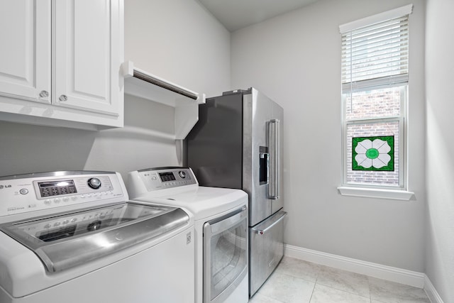 720 Waterbrook Pkwy, Argyle, TX 76226 - laundry area featuring washing machine and dryer, cabinet space, and baseboards