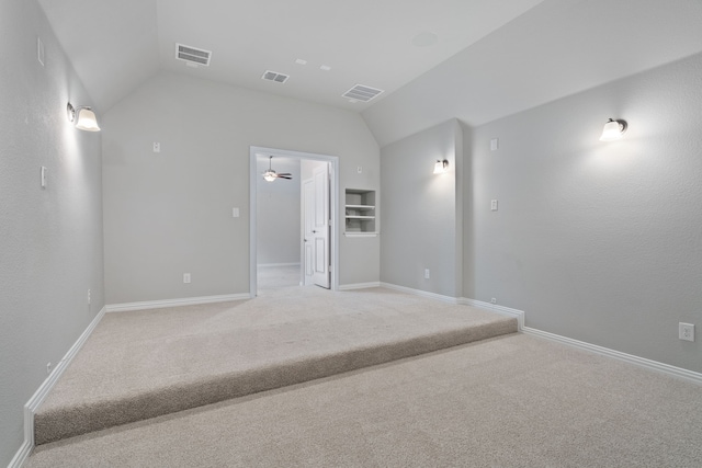 720 Waterbrook Pkwy, Argyle, TX 76226 - spare room with vaulted ceiling, light carpet, ceiling fan, and baseboards