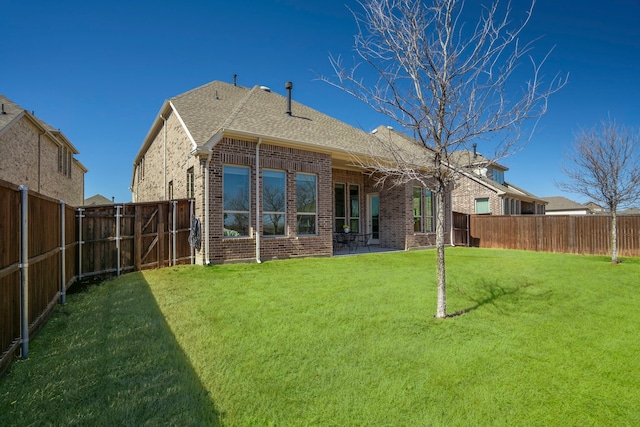 720 Waterbrook Pkwy, Argyle, TX 76226 - back of property featuring brick siding and roof with shingles