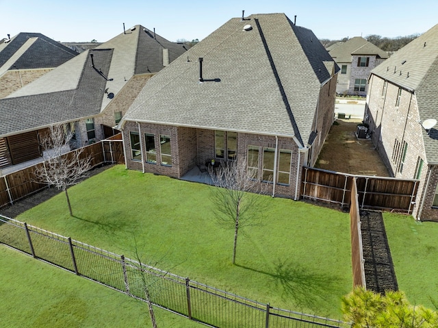720 Waterbrook Pkwy, Argyle, TX 76226 - rear view of house featuring brick siding, a shingled roof, central AC unit, and a patio