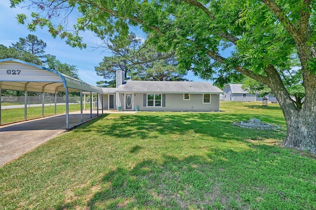 627 Coe Rd, Denison, TX 75021 - back of property featuring a chimney, a carport, and driveway