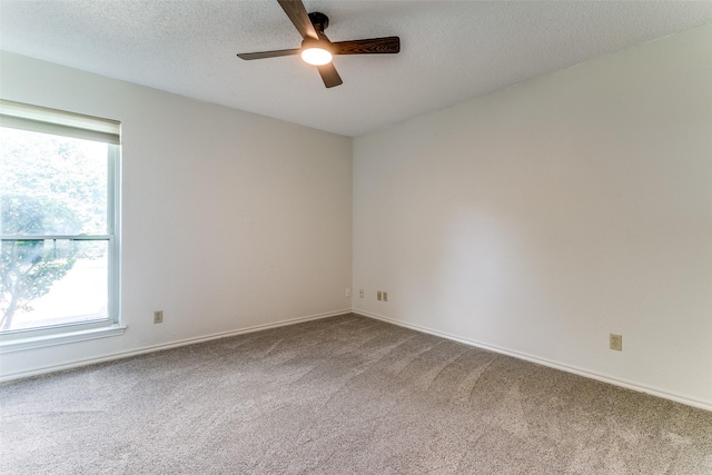 3616 Rolling Meadows Dr, Bedford, TX 76021 - carpeted empty room with a ceiling fan, healthy amount of natural light, baseboards, and a textured ceiling