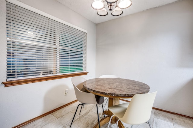 2708 Winchester Ct, Denton, TX 76209 - dining area featuring baseboards and a chandelier