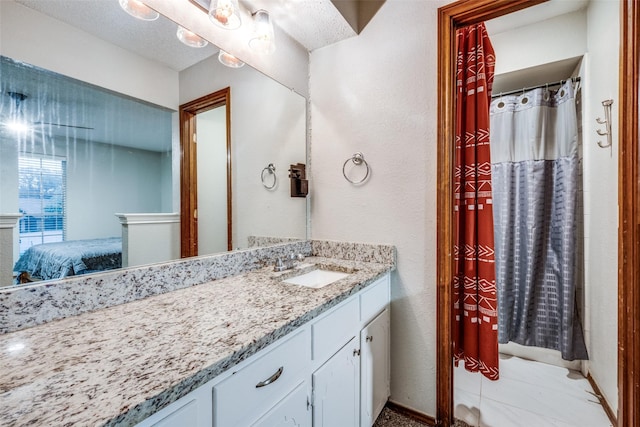 2708 Winchester Ct, Denton, TX 76209 - full bath with ensuite bathroom, vanity, and a textured wall
