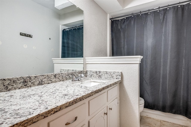 2708 Winchester Ct, Denton, TX 76209 - bathroom with toilet, vanity, tile patterned flooring, a shower with curtain, and a textured wall