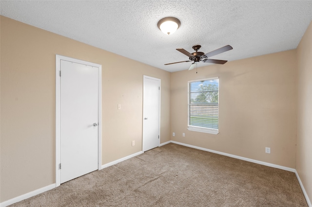 163 Private Road 605, Marlin, TX 76661 - unfurnished bedroom featuring carpet floors, a textured ceiling, and baseboards