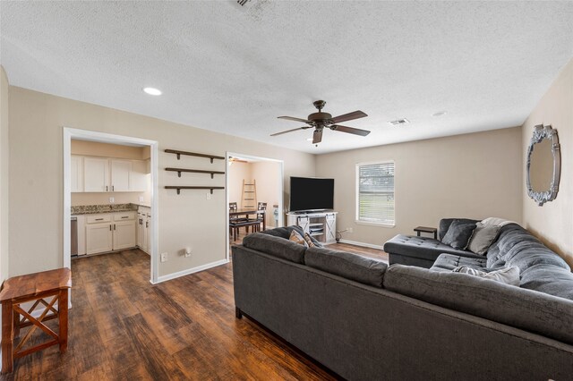 163 Private Road 605, Marlin, TX 76661 - living room featuring dark wood-type flooring, ceiling fan, a textured ceiling, baseboards, and recessed lighting