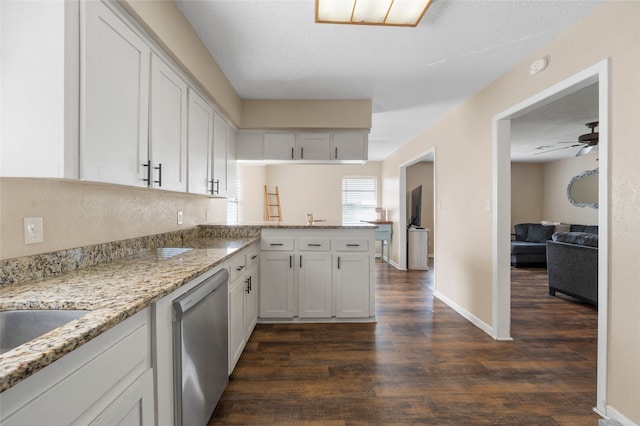163 Private Road 605, Marlin, TX 76661 - kitchen with stainless steel dishwasher, dark wood-style floors, white cabinetry, and ceiling fan