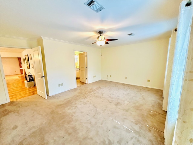 408 Briarwood Dr, Eastland, TX 76448 - spare room featuring a ceiling fan, light carpet, ornamental molding, and baseboards
