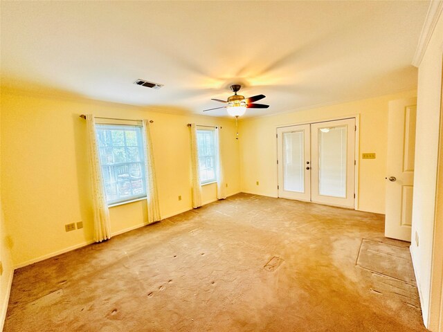 408 Briarwood Dr, Eastland, TX 76448 - unfurnished room with ornamental molding, french doors, a ceiling fan, light colored carpet, and baseboards