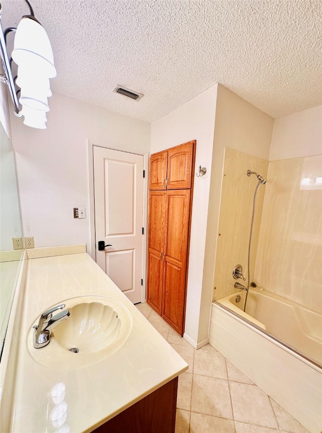 408 Briarwood Dr, Eastland, TX 76448 - full bath with tub / shower combination, tile patterned flooring, vanity, and a textured ceiling