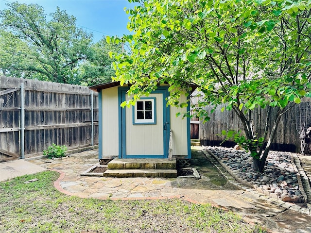 408 Briarwood Dr, Eastland, TX 76448 - view of shed with a fenced backyard and entry steps