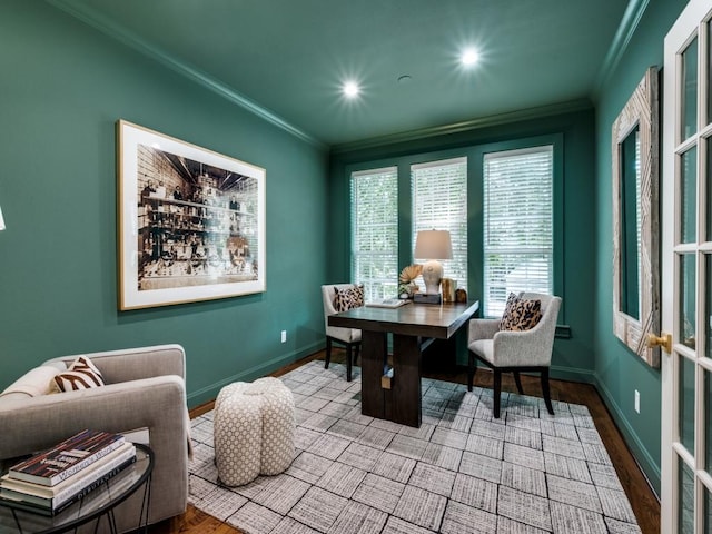 dining area with ornamental molding, wood finished floors, and baseboards