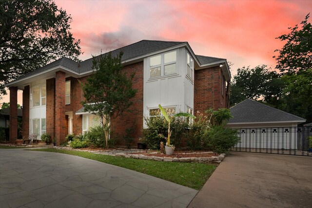 2608 Rivercrest Dr, Arlington, TX 76006 - view of front of home with brick siding, concrete driveway, and a shingled roof