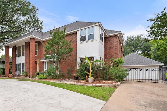 2608 Rivercrest Dr, Arlington, TX 76006 - view of front facade with driveway, brick siding, and roof with shingles