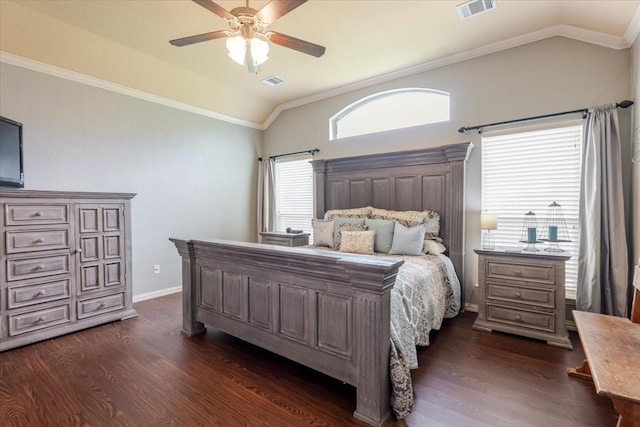 bedroom featuring vaulted ceiling, crown molding, dark wood-type flooring, ceiling fan, and baseboards