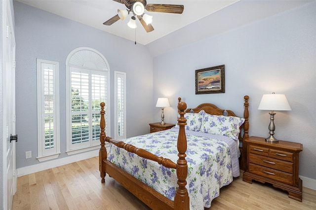 4920 Ridge Cir, Benbrook, TX 76126 - bedroom featuring light wood-style floors, baseboards, vaulted ceiling, and ceiling fan