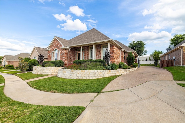 4920 Ridge Cir, Benbrook, TX 76126 - view of front of property featuring brick siding, a front yard, and roof with shingles