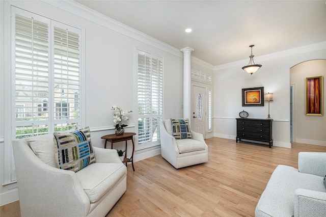 4920 Ridge Cir, Benbrook, TX 76126 - sitting room featuring light wood-type flooring, crown molding, arched walkways, and baseboards