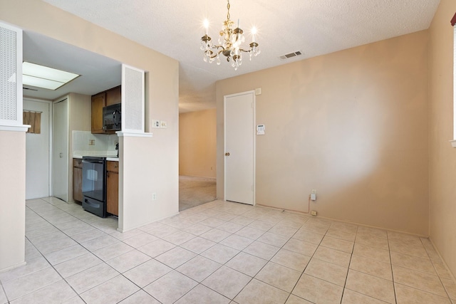720 Oceanview Dr, Dallas, TX 75232 - unfurnished living room with a chandelier and light tile patterned flooring
