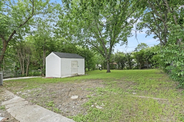 5101 Penrod Ct, River Oaks, TX 76114 - view of grassy yard with a storage unit, an outdoor structure, and cooling unit