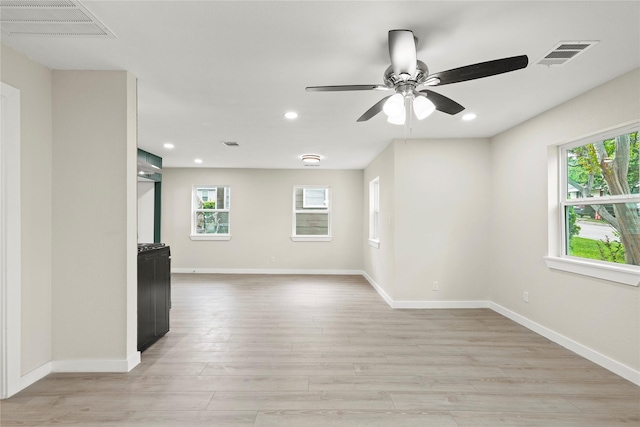 5101 Penrod Ct, River Oaks, TX 76114 - unfurnished room with plenty of natural light, light wood finished floors, recessed lighting, and ceiling fan