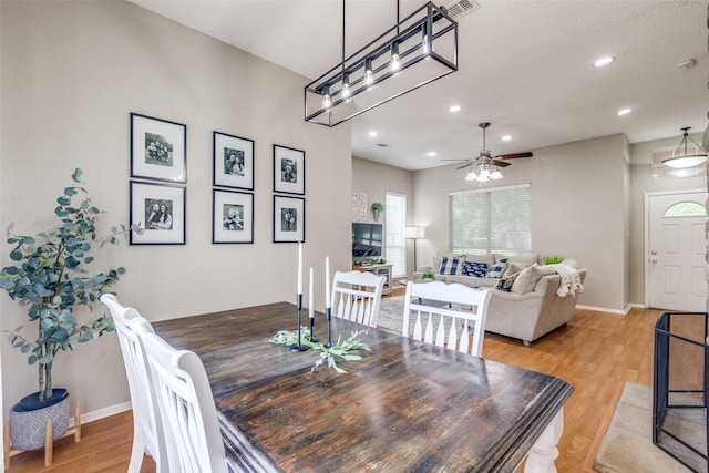 dining space with light wood finished floors, ceiling fan, baseboards, and recessed lighting