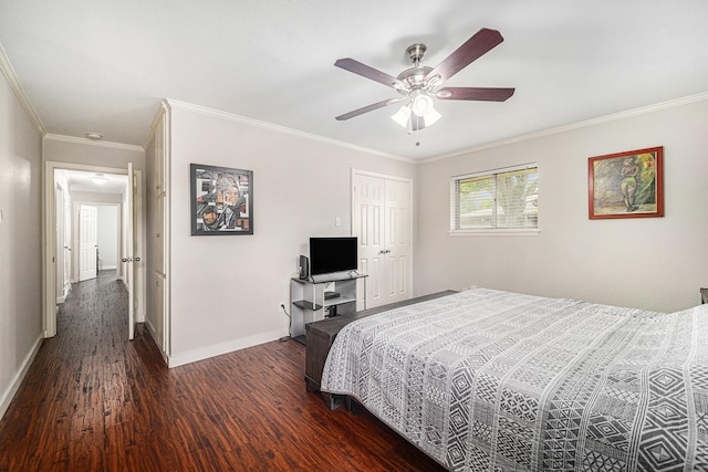bedroom with wood finished floors, baseboards, crown molding, a closet, and a ceiling fan