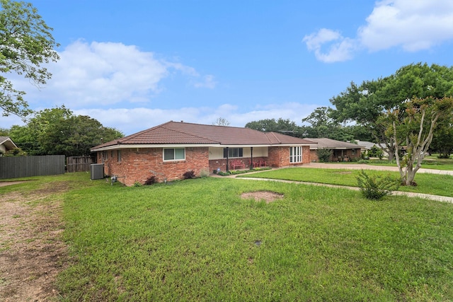5816 Whitman Ave, Fort Worth, TX 76133 - rear view of house with central AC unit, a tile roof, driveway, and brick siding