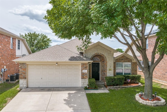 4012 Summerhill Ln, Fort Worth, TX 76244 - traditional-style house featuring stone siding, a garage, a front lawn, and driveway