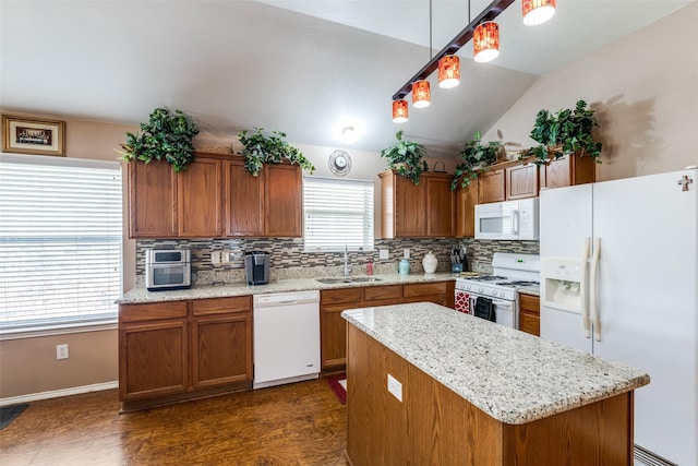 4012 Summerhill Ln, Fort Worth, TX 76244 - kitchen featuring white appliances, a sink, backsplash, brown cabinetry, and vaulted ceiling