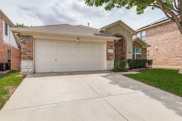 4012 Summerhill Ln, Fort Worth, TX 76244 - view of front of house with stone siding, a garage, concrete driveway, brick siding, and cooling unit