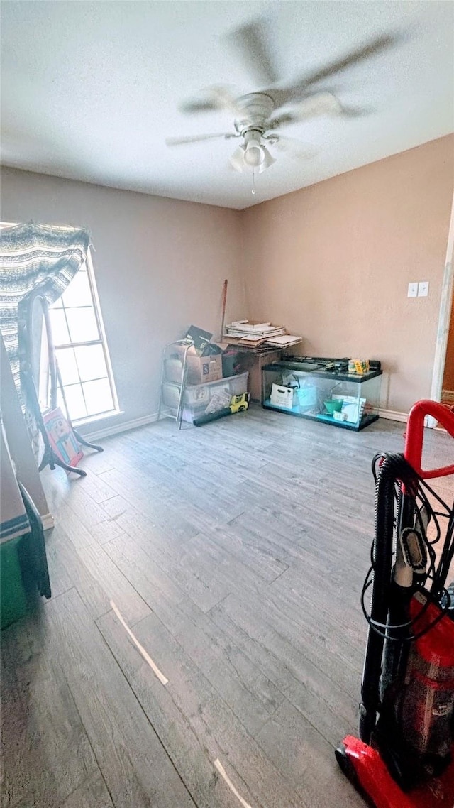 3104 Wintersmith Dr, Arlington, TX 76014 - bedroom featuring wood finished floors, baseboards, and a ceiling fan
