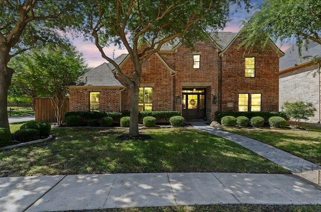 traditional-style home with brick siding