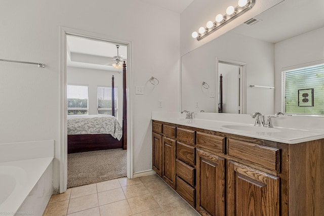 1837 Trail Dr, Rockwall, TX 75087 - ensuite bathroom featuring double vanity, tile patterned floors, and a bath