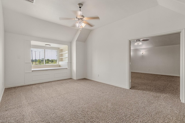 1837 Trail Dr, Rockwall, TX 75087 - unfurnished room featuring light carpet, ceiling fan, lofted ceiling, and baseboards