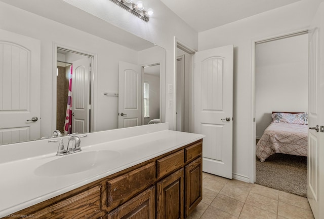 1837 Trail Dr, Rockwall, TX 75087 - ensuite bathroom featuring tile patterned floors and vanity