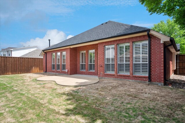 11968 Cobblestone Dr, Frisco, TX 75035 - rear view of property featuring brick siding, a patio, and roof with shingles