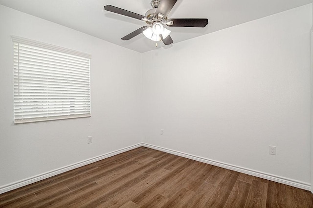 1021 Pangburn St, Grand Prairie, TX 75051 - spare room featuring wood finished floors, a ceiling fan, and baseboards