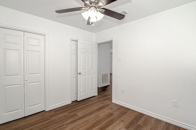 1021 Pangburn St, Grand Prairie, TX 75051 - unfurnished bedroom with baseboards, dark wood finished floors, and a ceiling fan