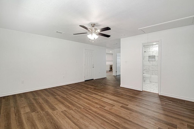 1021 Pangburn St, Grand Prairie, TX 75051 - unfurnished bedroom featuring attic access, wood finished floors, baseboards, and connected bathroom