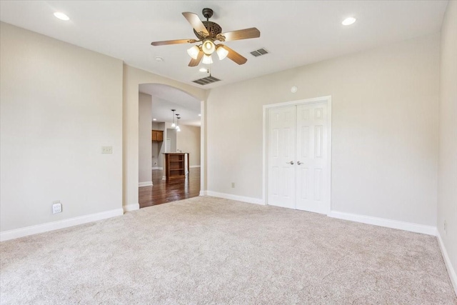 3439 Willow Branch Rd, Mcgregor, TX 76657 - unfurnished bedroom featuring carpet floors, arched walkways, recessed lighting, baseboards, and a closet