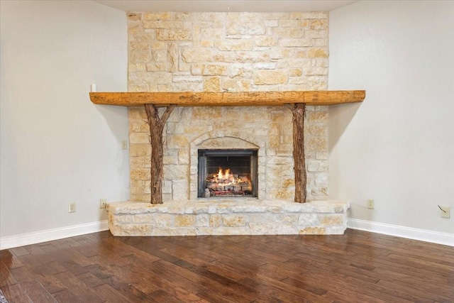 3439 Willow Branch Rd, Mcgregor, TX 76657 - detailed view of wood finished floors, baseboards, and a fireplace