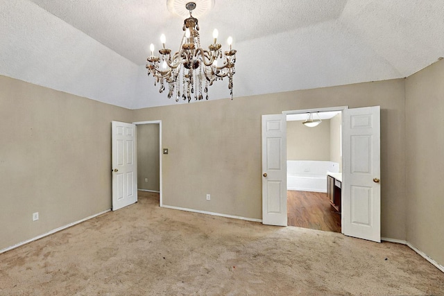1523 Allen Dr, Cedar Hill, TX 75104 - unfurnished bedroom with carpet flooring, a chandelier, a textured ceiling, and baseboards