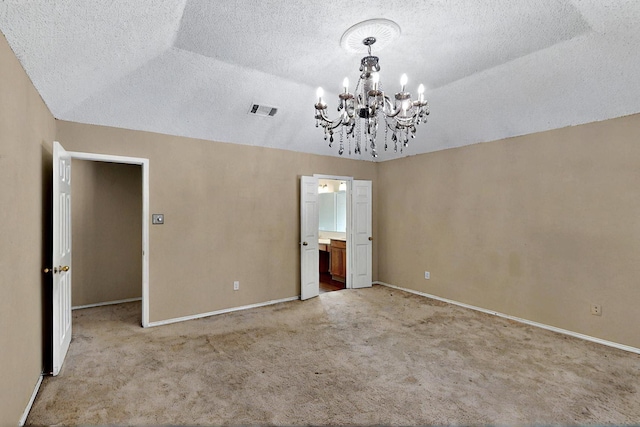 1523 Allen Dr, Cedar Hill, TX 75104 - unfurnished bedroom featuring a chandelier, carpet, baseboards, a textured ceiling, and vaulted ceiling