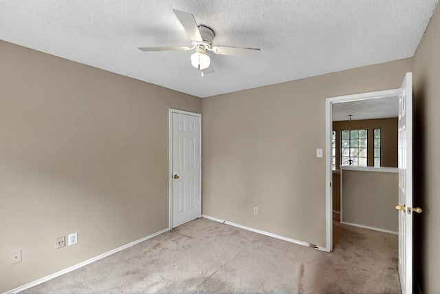 1523 Allen Dr, Cedar Hill, TX 75104 - empty room featuring carpet floors, a ceiling fan, baseboards, and a textured ceiling