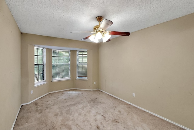 1523 Allen Dr, Cedar Hill, TX 75104 - carpeted empty room with ceiling fan, baseboards, and a textured ceiling