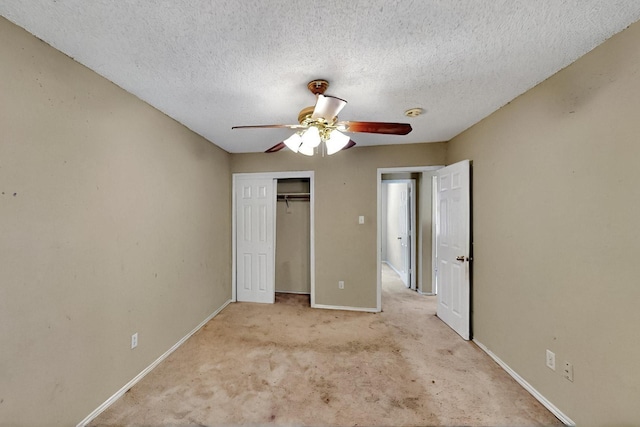 1523 Allen Dr, Cedar Hill, TX 75104 - unfurnished bedroom featuring carpet flooring, a closet, baseboards, a textured ceiling, and a ceiling fan